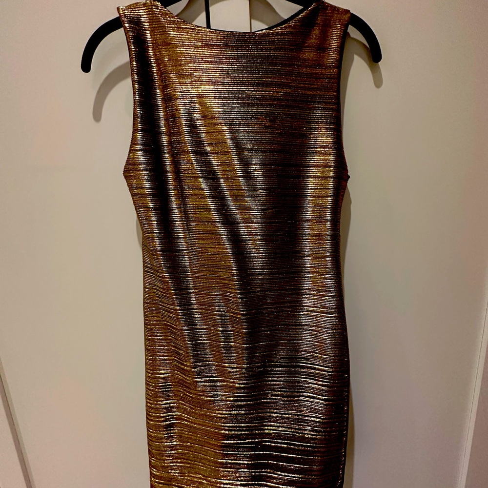Shiny to tight mini dress with open mesh back Medium but fits XS or S